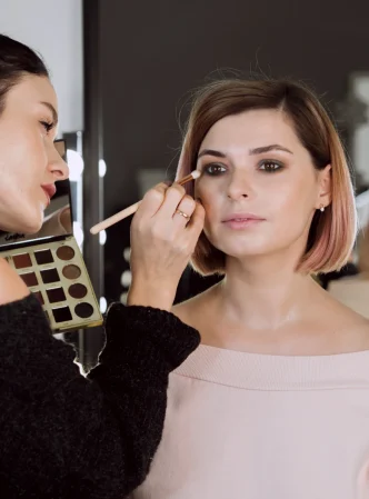 artist-applying-make-up-cute-model artist-applying-make-up-cute-model