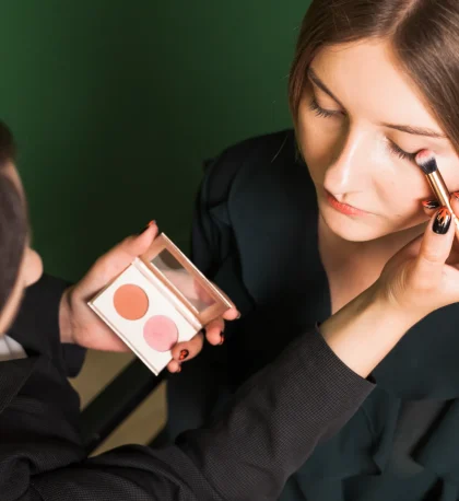 professional-woman-making-up-girl-s-eyes
