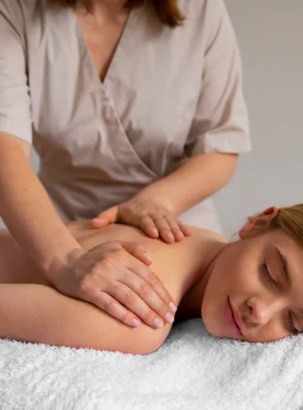 woman-getting-back-massage-from-masseur