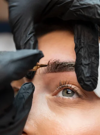 young-woman-getting-beauty-treatment-her-eyebrows